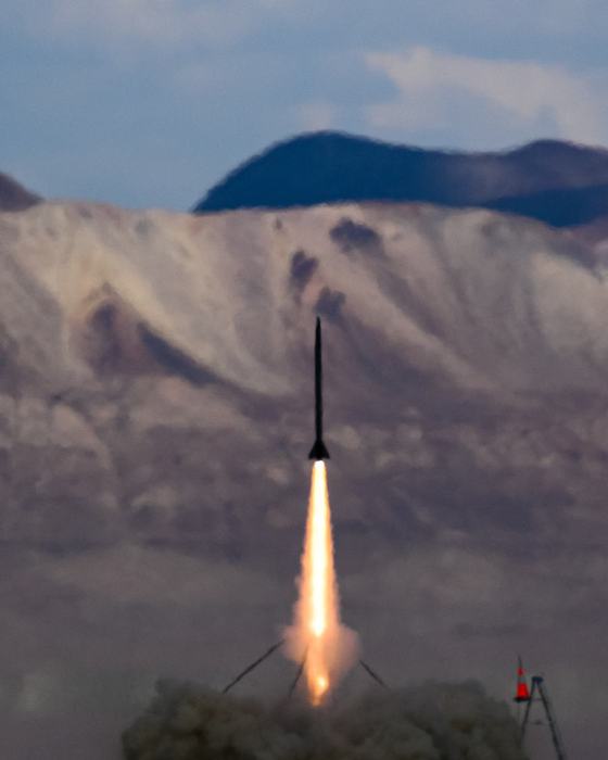 ION 4.3 climbing off the tower at XPRS on an O5500X, desert mountains behind